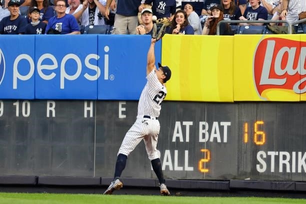 Right fielder Giancarlo Stanton of the New York Yankees makes a catch on a ball hit by Trey Mancini of the Baltimore Orioles during the eighth inning...