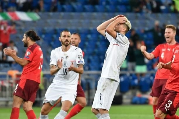 Italy's midfielder Jorginho reacts after missing a penalty kick during the World Cup 2022 qualifier football match between Switzerland and Italy, on...