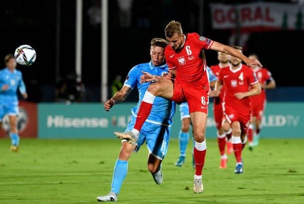 Micha Helik of Poland competes for the ball with Nicola Luca Nanni of San Marino during the 2022 FIFA World Cup Qualifier match between San Marino...