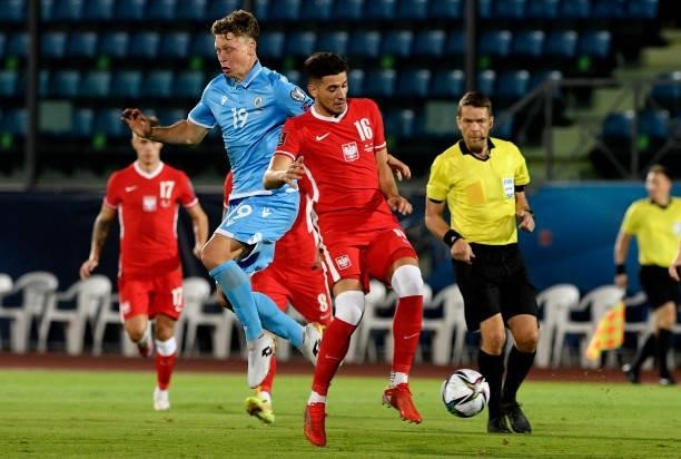 Jakub Moder of Poland competes for the ball with Nicola Luca Nanni of San Marino ,during the 2022 FIFA World Cup Qualifier match between San Marino...