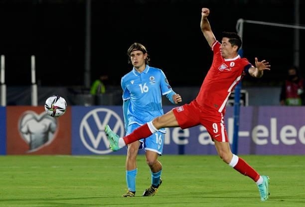 Robert Lewandowski of Poland competes for the ball with Filippo Fabbri of San Marino ,during the 2022 FIFA World Cup Qualifier match between San...
