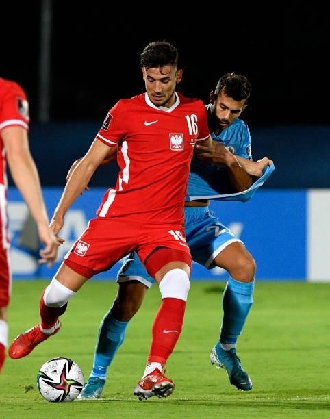 Jakub Moder of Poland competes for the ball with Lorenzo Lunadei of San Marino during the 2022 FIFA World Cup Qualifier match between San Marino and...