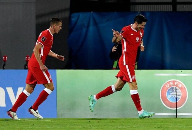 Robert Lewandowski of Poland celebrates with team mates Jakub Kaminski after scores his 2nd Goal ,during the 2022 FIFA World Cup Qualifier match...