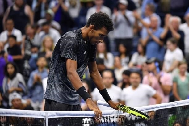 Canada's Felix Auger-Aliassime stands at the net as he reacts after winning his 2021 US Open Tennis tournament men's singles fourth round match...