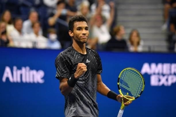 Canada's Felix Auger-Aliassime celebrates after winning his 2021 US Open Tennis tournament men's singles fourth round match against USA's Frances...