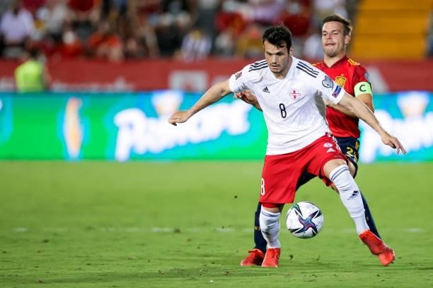 Valeri Qazaishvili of Georgia, Cesar Azpilicueta of Spain during the World Cup Qualifier match between Spain v Georgia at the Estadio La Cartuja on...