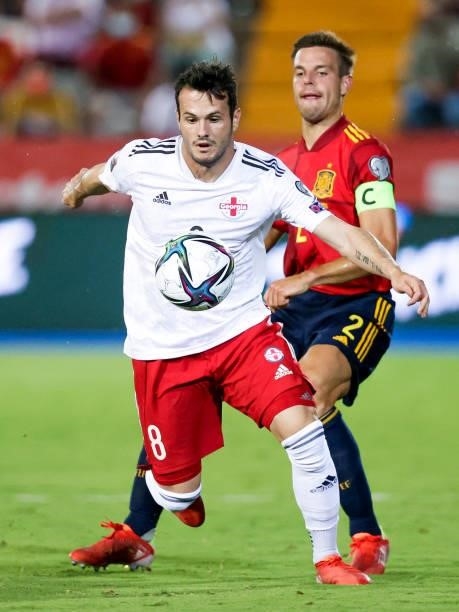 Valeri Qazaishvili of Georgia, Cesar Azpilicueta of Spain during the World Cup Qualifier match between Spain v Georgia at the Estadio La Cartuja on...