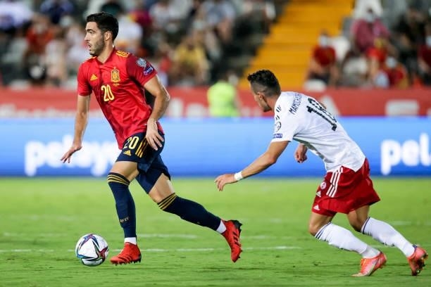 Mikel Merino of Spain, Vladimer Mamuchashvili of Georgia during the World Cup Qualifier match between Spain v Georgia at the Estadio La Cartuja on...