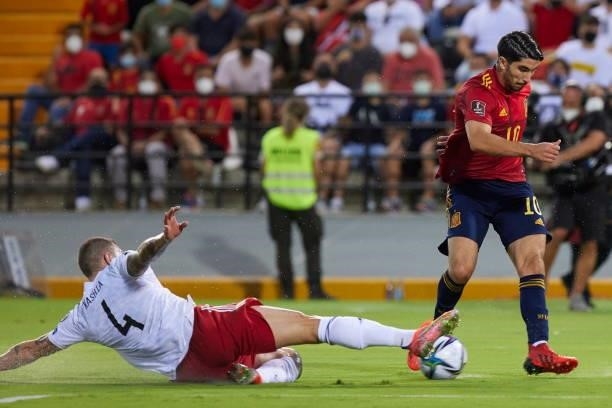 Carlos Soler of Spain and Guram Kashia of Georgia battle for the ball during the 2022 FIFA World Cup Qualifier match between Spain and Georgia at...