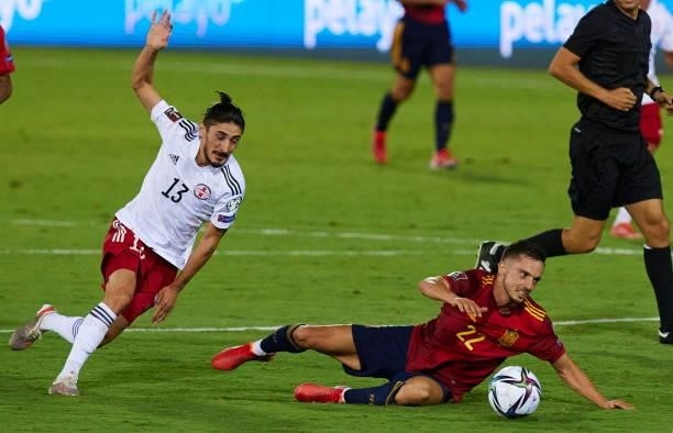 Grigol Chabradze of Georgia and Pablo Sarabia of Spain battle for the ball during the 2022 FIFA World Cup Qualifier match between Spain and Georgia...
