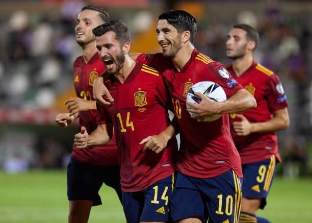 Jose Gaya of Spain and Carlos Soler of Spain celebrates after scoring his teams during the 2022 FIFA World Cup Qualifier match between Spain and...