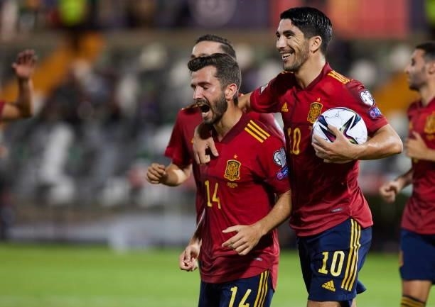 Jose Gaya of Spain and Carlos Soler of Spain celebrates after scoring his teams goal during the 2022 FIFA World Cup Qualifier match between Spain and...