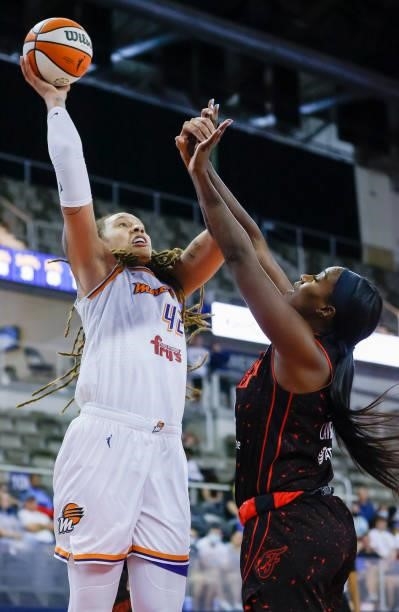 Brittney Griner of the Phoenix Mercury shoots the ball against Jantel Lavender of the Indiana Fever during the game at Indiana Farmers Coliseum on...