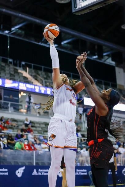 Brittney Griner of the Phoenix Mercury shoots the ball against Jantel Lavender of the Indiana Fever during the game at Indiana Farmers Coliseum on...
