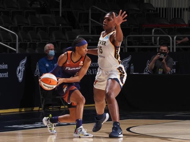 Teaira McCowan of the Indiana Fever plays defense on Shey Peddy of the Phoenix Mercury during the game on September 6, 2021 at Bankers Life...