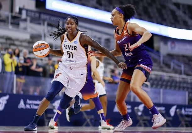 Jessica Breland of the Indiana Fever dribbles the ball around Brianna Turner of the Phoenix Mercury at Indiana Farmers Coliseum on September 6, 2021...