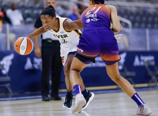 Lindsay Allen of the Indiana Fever dribbles the ball during the game against the Phoenix Mercury at Indiana Farmers Coliseum on September 6, 2021 in...
