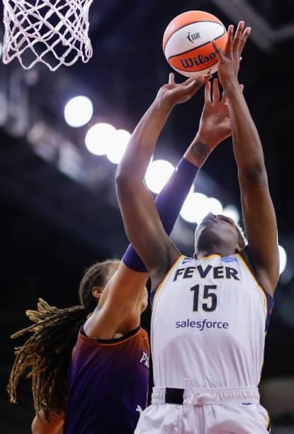Teaira McCowan of the Indiana Fever reaches for the ball against Brittney Griner of the Phoenix Mercury at Indiana Farmers Coliseum on September 6,...