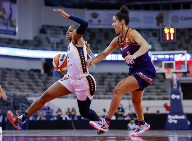 Tiffany Mitchell of the Indiana Fever drives to the basket against Kia Nurse of the Phoenix Mercury at Indiana Farmers Coliseum on September 6, 2021...