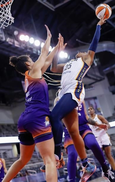 Tiffany Mitchell of the Indiana Fever shoots the ball against Kia Nurse of the Phoenix Mercury at Indiana Farmers Coliseum on September 6, 2021 in...