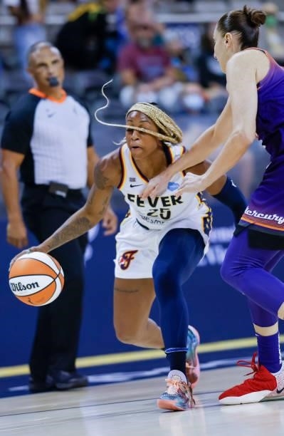 Tiffany Mitchell of the Indiana Fever dribbles the ball during the game against the Phoenix Mercury at Indiana Farmers Coliseum on September 6, 2021...