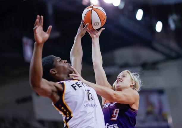 Sophie Cunningham of the Phoenix Mercury shoots the ball against Teaira McCowan of the Indiana Fever at Indiana Farmers Coliseum on September 6, 2021...