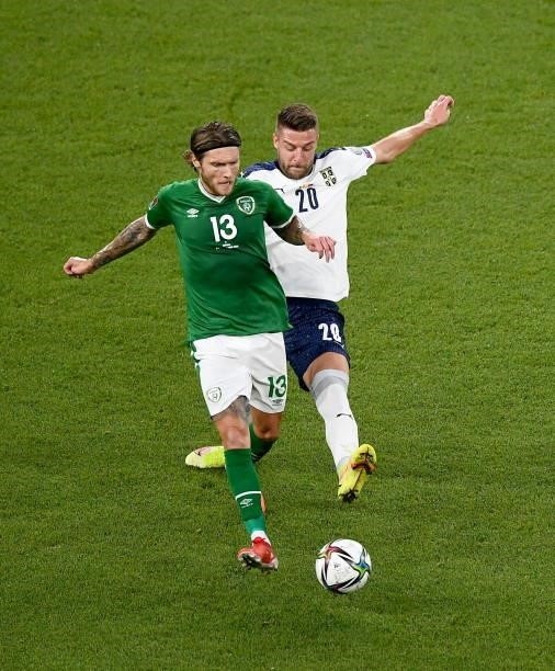 Dublin , Ireland - 7 September 2021; Jeff Hendrick of Republic of Ireland is tackled by Sergej Milinkovi­-Savi of Serbia during the FIFA World Cup...