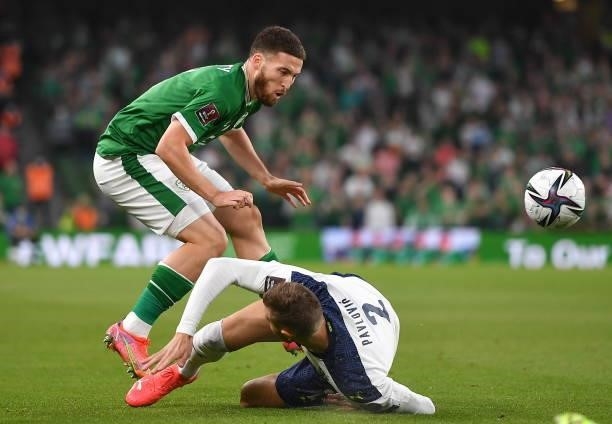 Dublin , Ireland - 7 September 2021; Matt Doherty of Republic of Ireland is fouled by Strahinja Pavlovi of Serbia during the FIFA World Cup 2022...