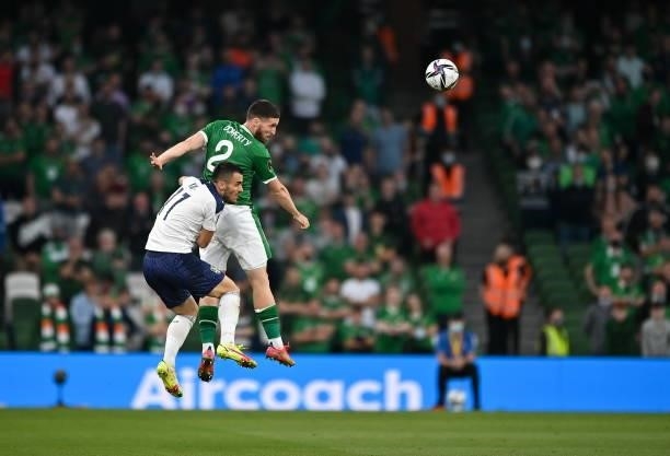 Dublin , Ireland - 7 September 2021; Matt Doherty of Republic of Ireland in action against Filip Kosti of Serbia during the FIFA World Cup 2022...