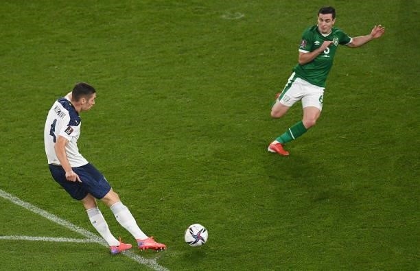 Dublin , Ireland - 7 September 2021; Nikola Milenkovi of Serbia has a shot on goal depite the attempts of Josh Cullen of Republic of Ireland during...