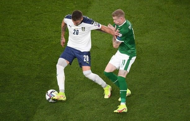 Dublin , Ireland - 7 September 2021; Saa Luki of Serbia in action against James McClean of Republic of Ireland during the FIFA World Cup 2022...