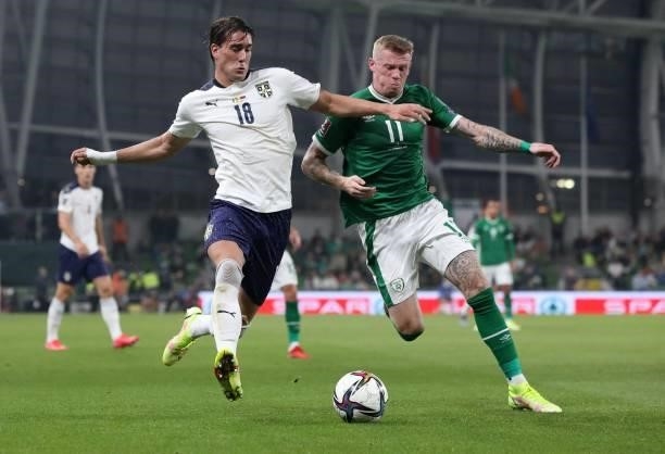 Serbia's forward Dusan Vlahovic vies with Republic of Ireland's midfielder James McClean during the FIFA World Cup Qatar 2022 qualifying round Group...