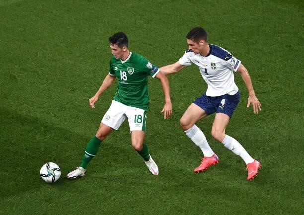 Dublin , Ireland - 7 September 2021; Jamie McGrath of Republic of Ireland in action against Nikola Milenkovi of Serbia during the FIFA World Cup 2022...