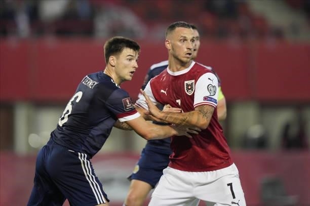 Kieran Tierney of Scotland and Marko Arnautovic of Austria during the 2022 FIFA World Cup Qualifier match between Austria and Scotland at Ernst...