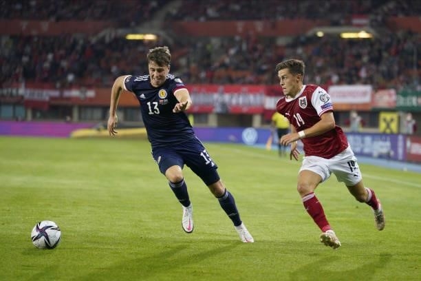 Jack Hendry of Scotland and Christoph Baumgartner of Austria during the 2022 FIFA World Cup Qualifier match between Austria and Scotland at Ernst...