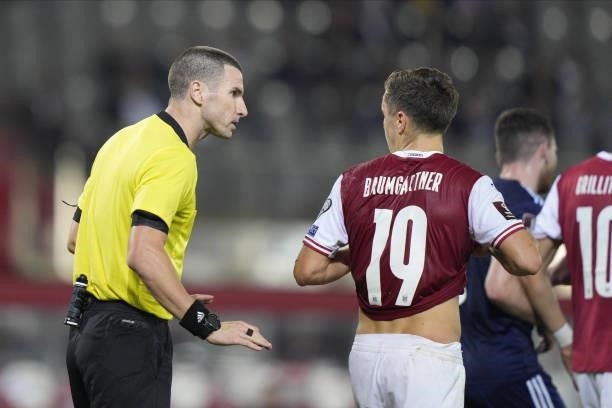 Referee Georgi Kabakov of Bulgaria and Christoph Baumgartner of Austria during the 2022 FIFA World Cup Qualifier match between Austria and Scotland...