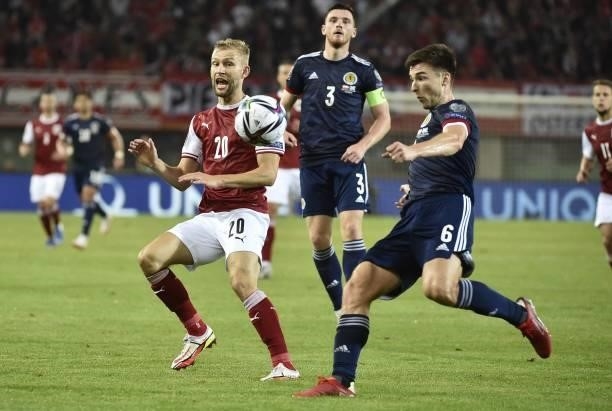 Austria's midfielder Konrad Laimer and Scotland's defender Kieran Tierney vie for the ball during the FIFA World Cup Qatar 2022 qualification Group F...