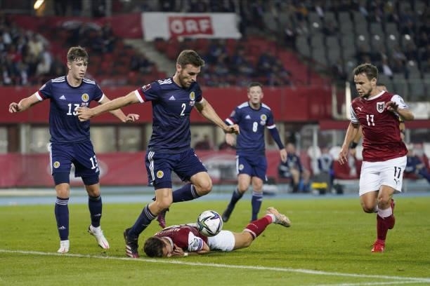 Stephen O Donnell of Scotland, Christoph Baumgartner and Louis Schaub of Austria during the 2022 FIFA World Cup Qualifier match between Austria and...