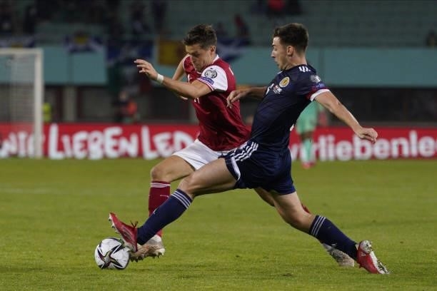 Christoph Baumgartner of Austria and Kieran Tierney of Scotland during the 2022 FIFA World Cup Qualifier match between Austria and Scotland at Ernst...