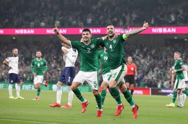 Republic of Ireland's defender John Egan and Republic of Ireland's defender Shane Duffy celebrate after Serbia's defender Nikola Milenkovic scored an...