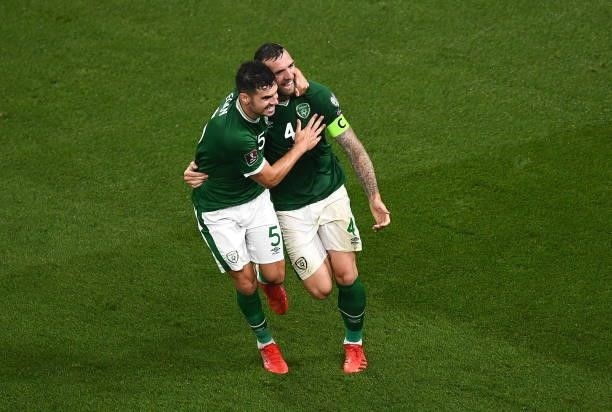 Dublin , Ireland - 7 September 2021; John Egan and Shane Duffy of Republic of Ireland celebrate after their side's first goal, an own goal scored by...