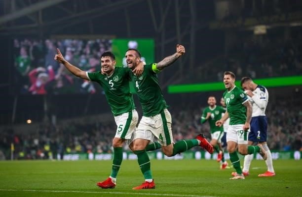Dublin , Ireland - 7 September 2021; John Egan and Shane Duffy of Republic of Ireland celebrate after their side's first goal, an own goal scored by...