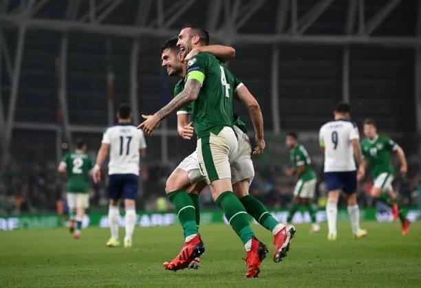 Dublin , Ireland - 7 September 2021; John Egan and Shane Duffy of Republic of Ireland celebrate their side's first goal, an own goal scored by Nikola...