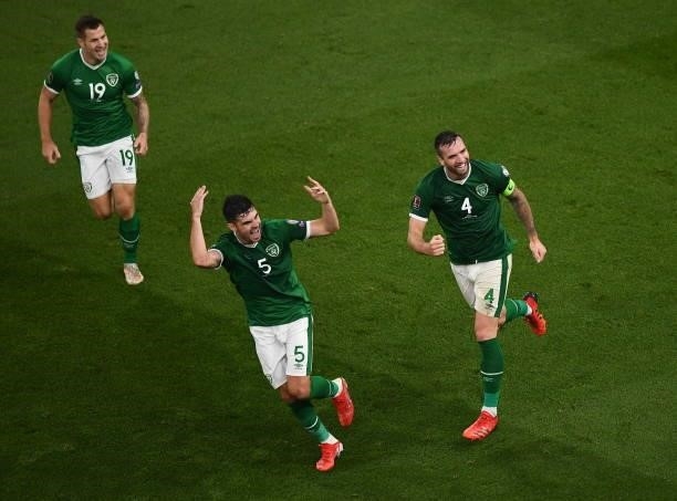 Dublin , Ireland - 7 September 2021; James Collins, John Egan and Shane Duffy of Republic of Ireland celebrate their side's first goal, an own goal...