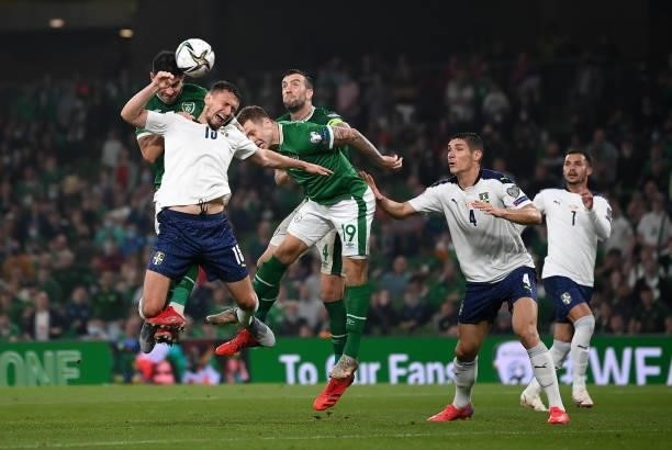 Dublin , Ireland - 7 September 2021; John Egan of Republic of Ireland contests a header against Milo Veljkovi of Serbia during the FIFA World Cup...