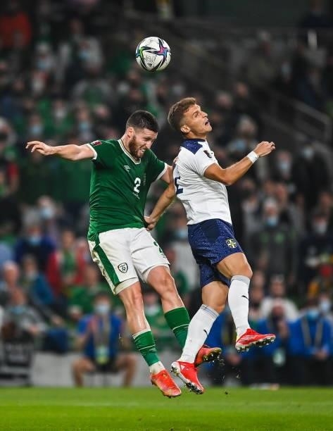 Dublin , Ireland - 7 September 2021; Matt Doherty of Republic of Ireland in action against Darko Lazovi of Serbia during the FIFA World Cup 2022...