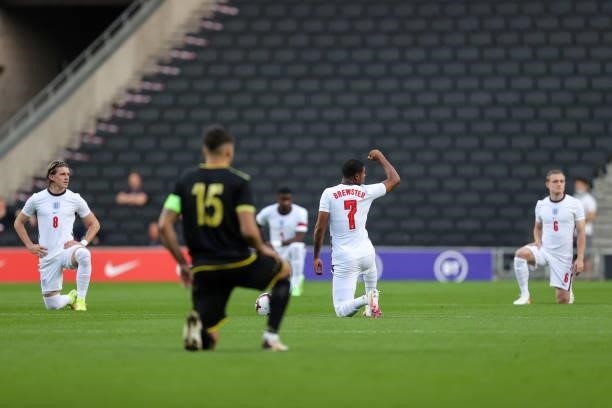 Rhian Brewster of England raises his fist as he takes the knee during the UEFA Under 21 Qualifier match between England and Kosovo U21 at Stadium mk...