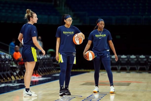 Marina Mabrey, Allisha Gray, and Arike Ogunbowale of the Dallas Wings warm up before the game against the Connecticut Sunon September 7, 2021 at...
