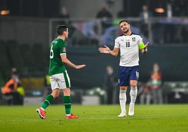 Dublin , Ireland - 7 September 2021; Duan Tadi of Serbia, right, and Josh Cullen of Republic of Ireland during the FIFA World Cup 2022 qualifying...
