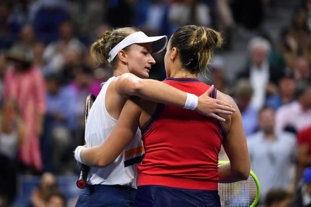 Belarus's Aryna Sabalenka hugs Czech Republic's Barbora Krejcikova after winning their 2021 US Open Tennis tournament women's quarter-finals match at...